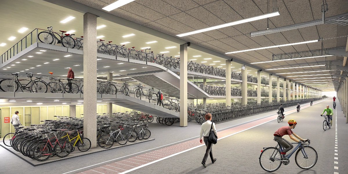 Large multi-level bike parking facility next to a Dutch train station